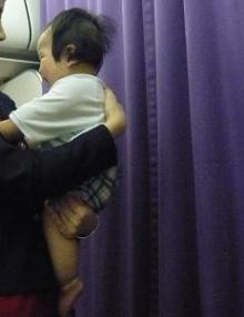 held by flight attendant